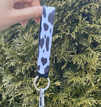 Load image into Gallery viewer, Black Cow Print Wristlet
